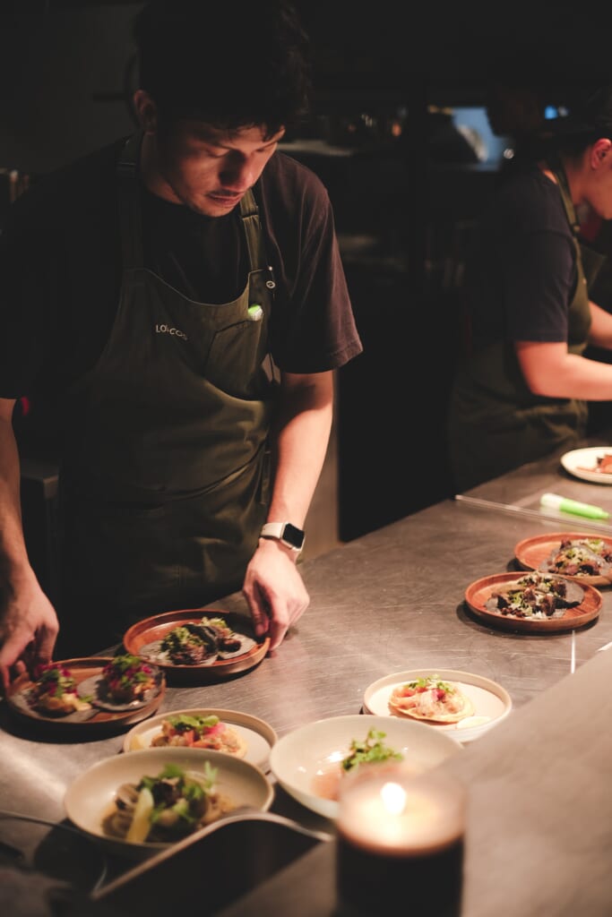 Chef Patrick Curitana plating dishes at Los Tacos MNL